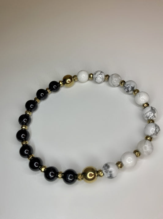 6mm howlite and black tourmaline beads 18K gold plated faceted rondelle hemetite and 18k Gold plated accent bead bracelet