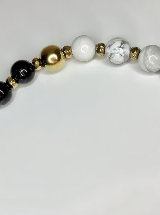 6mm howlite and black tourmaline beads 18K gold plated faceted rondelle hemetite and 18k Gold plated accent bead bracelet